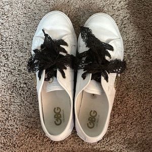 White sneakers with black lace laces